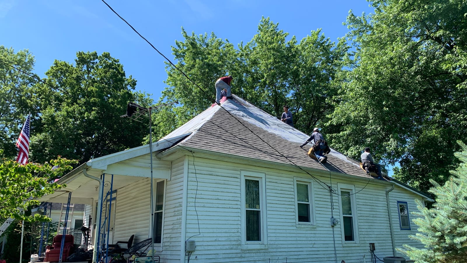 Copperline Roofing crew installing a new roof